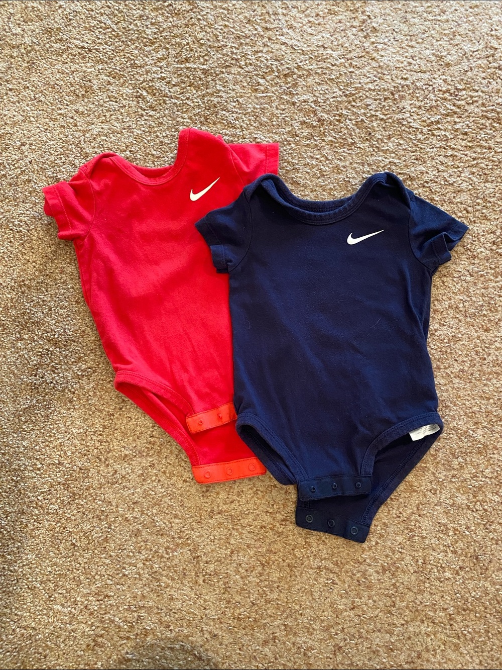 Set of Nike onesies